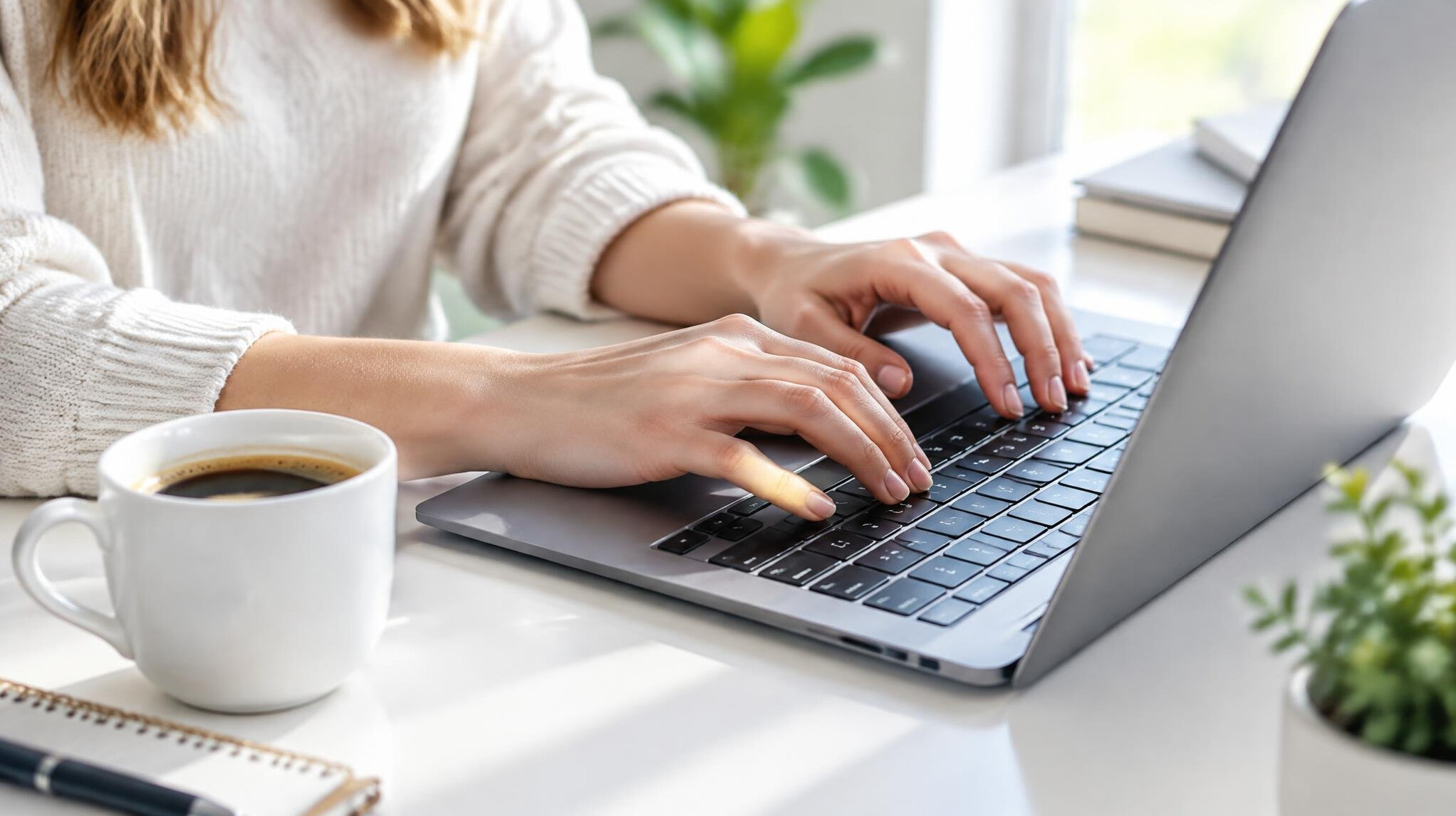 Person typing a short text on a laptop